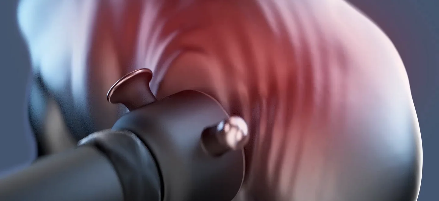 A HYAKO massager head worked across a shoulder, the muscle turning from cold and tight to warm